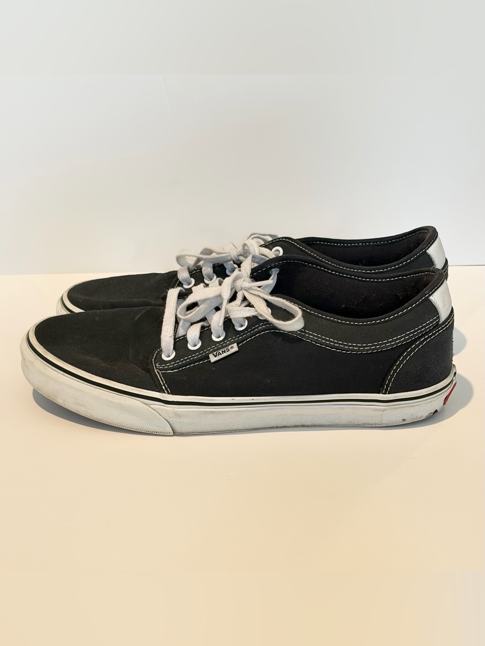 Vans Black Canvas Low-Profile Sneakers with White Laces.